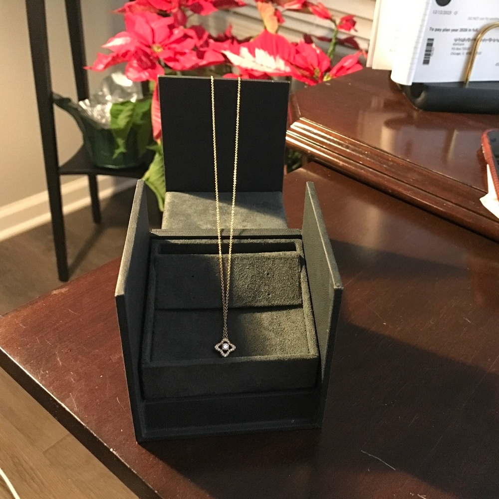 David Yurman gold necklace with diamond pendant.